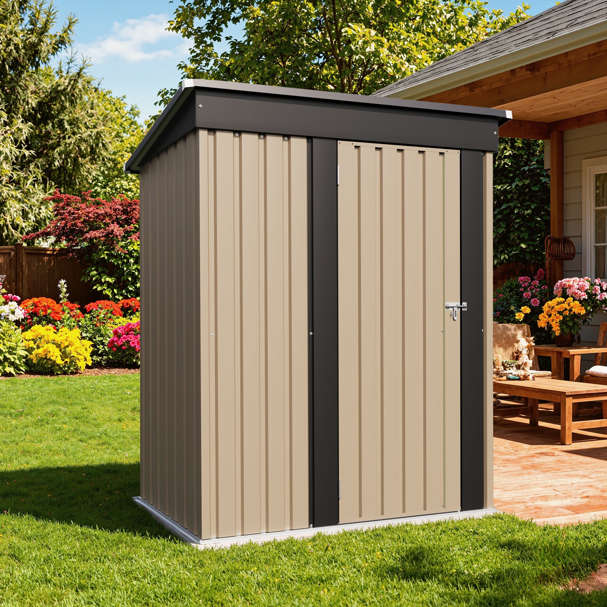 Small storage shed with beige and black exterior in a garden setting.
